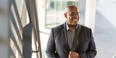 African American business man smiling as he walks