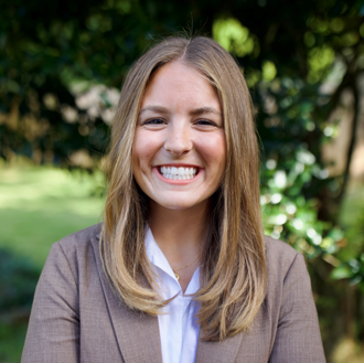 Headshot of Kate Mayfield, Community Engagement Coordinator at Protective