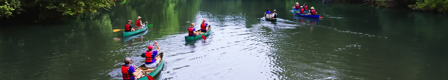 People canoeing down a calm river.