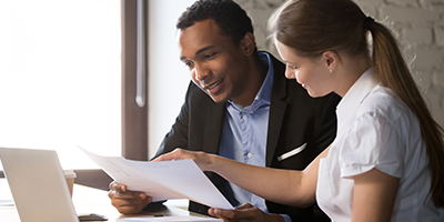A young woman meets with her financial planner to talk about the future