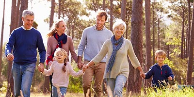 Multigenerational family hiking together.