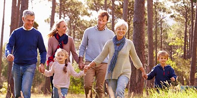 Multigenerational family hiking together. 