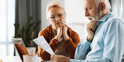 Senior couple contemplating Social Security benefits