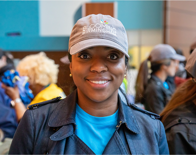 Volunteer smiling while participating in community involvement through Protective Life Foundation